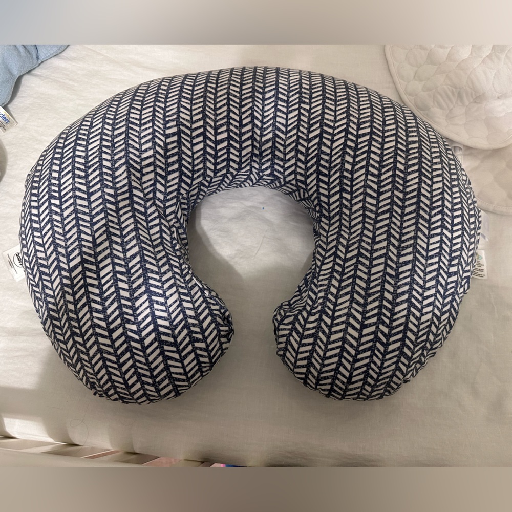 Boppy nursing pillow with blue and white cover